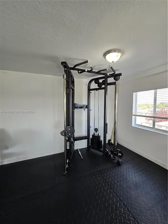 a view of a room with gym equipment