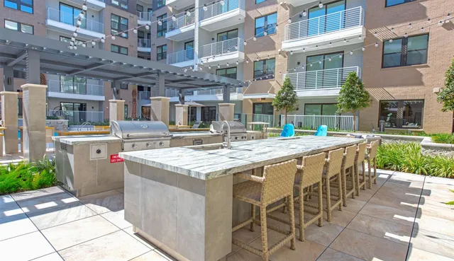 a view of a building with a table and chairs
