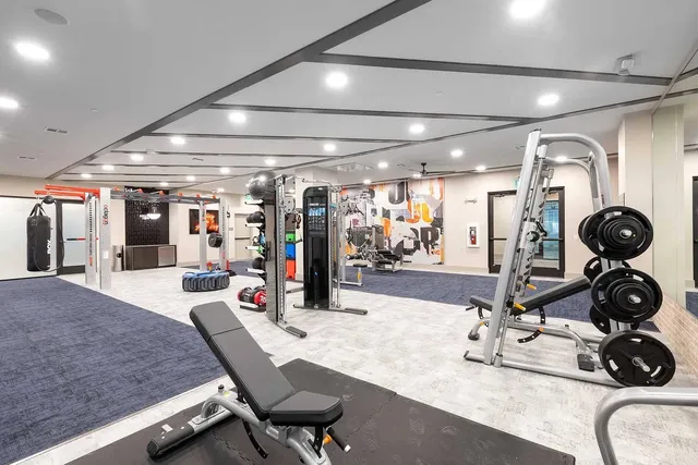 a room with lots of gym equipment