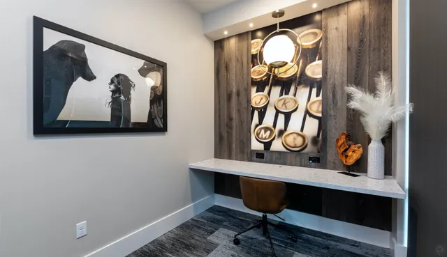 a view of a door with a painting on the wall