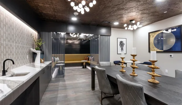 a large kitchen with a table and chairs