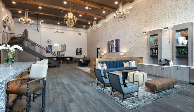a living room with lots of furniture and a chandelier