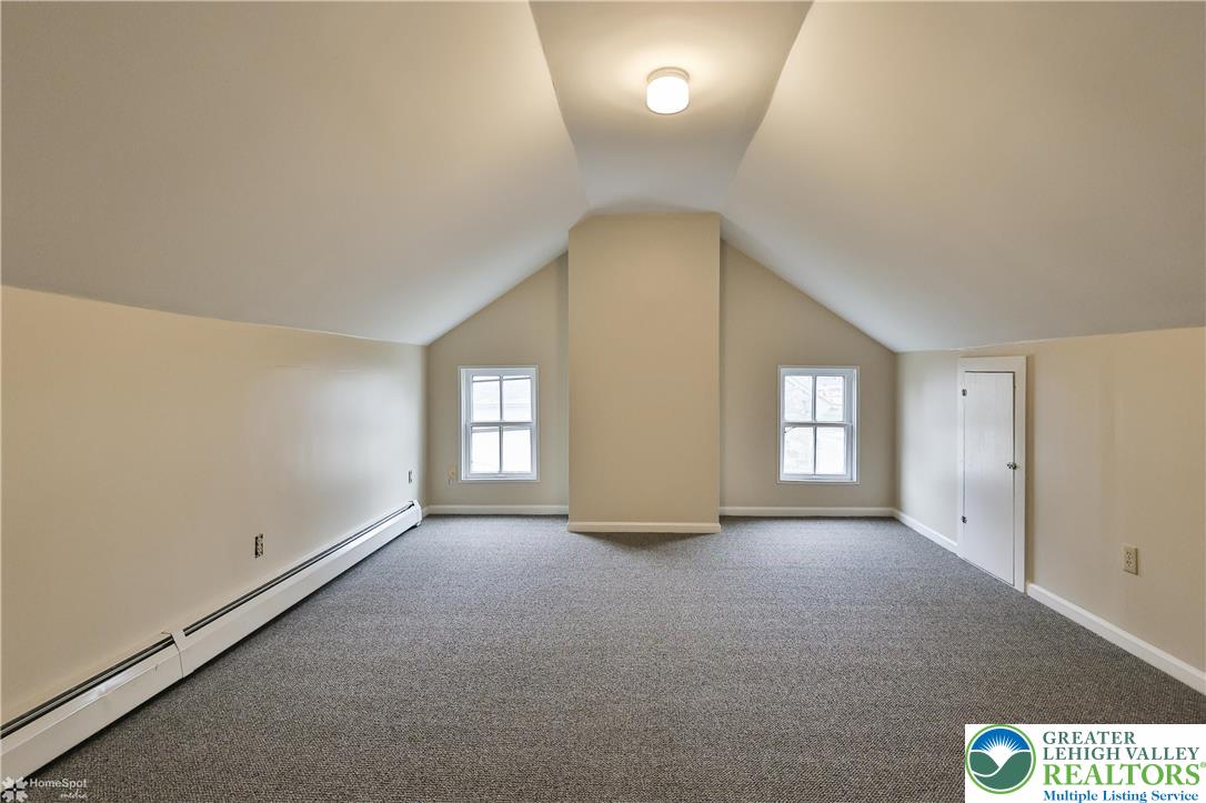 4448 Orefield Road Orefield, PA 18069 - Photo 16 of 20 a view of a big room with windows and chandelier fan