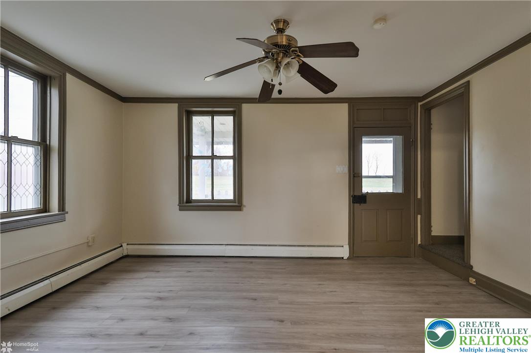 4448 Orefield Road Orefield, PA 18069 - Photo 18 of 20 a view of empty room with wooden floor and fan