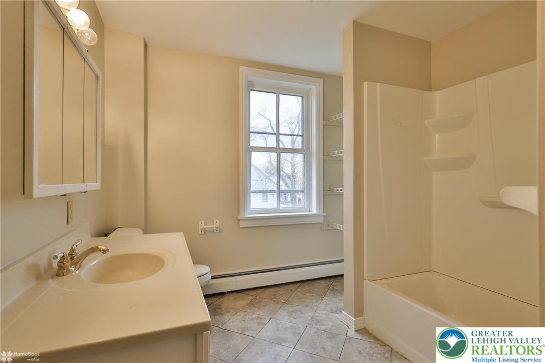 4448 Orefield Road Orefield, PA 18069 - Photo 19 of 20 a bathroom with a sink and a bathtub