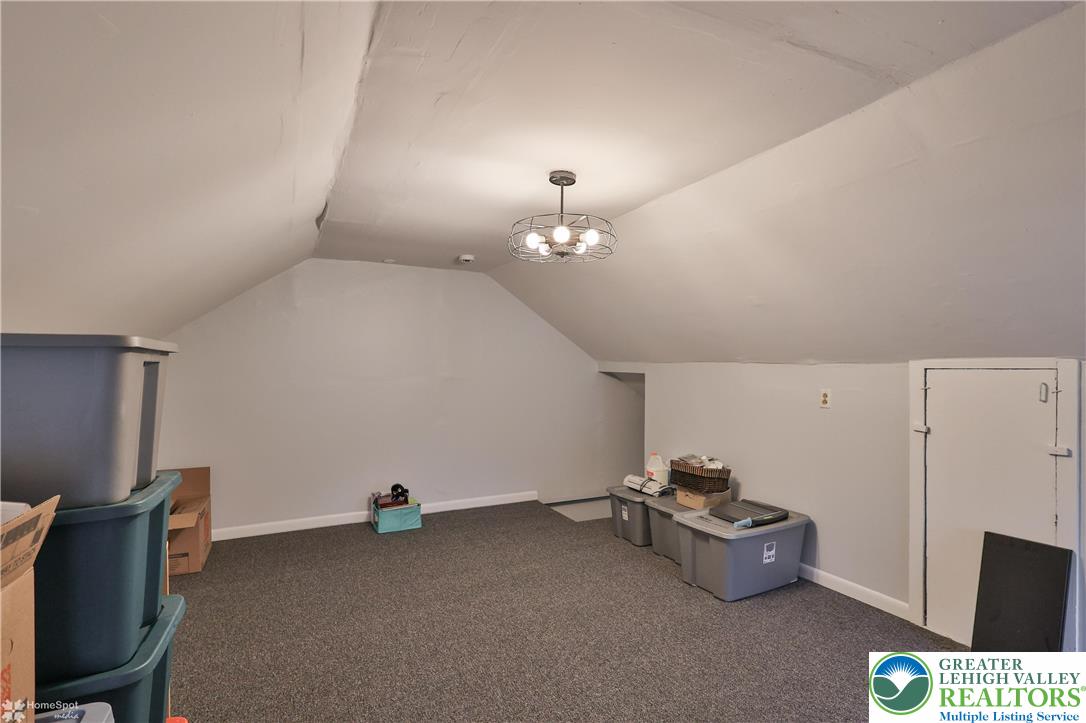 4448 Orefield Road Orefield, PA 18069 - Photo 7 of 20 a room with furniture and a chandelier fan