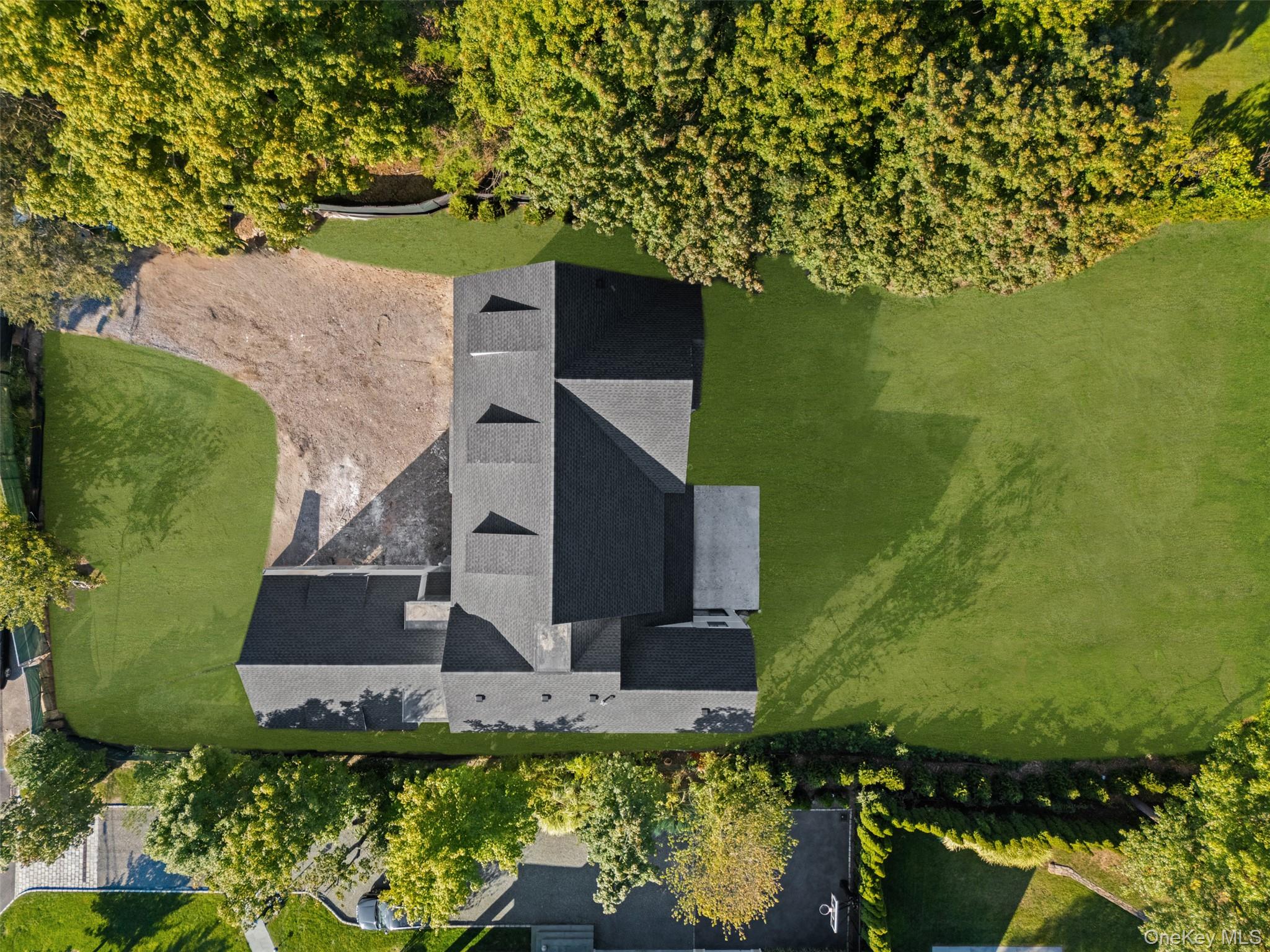 20 Cambridge Road Scarsdale, NY 10583 - Photo 4 of 6 an aerial view of a house with a yard