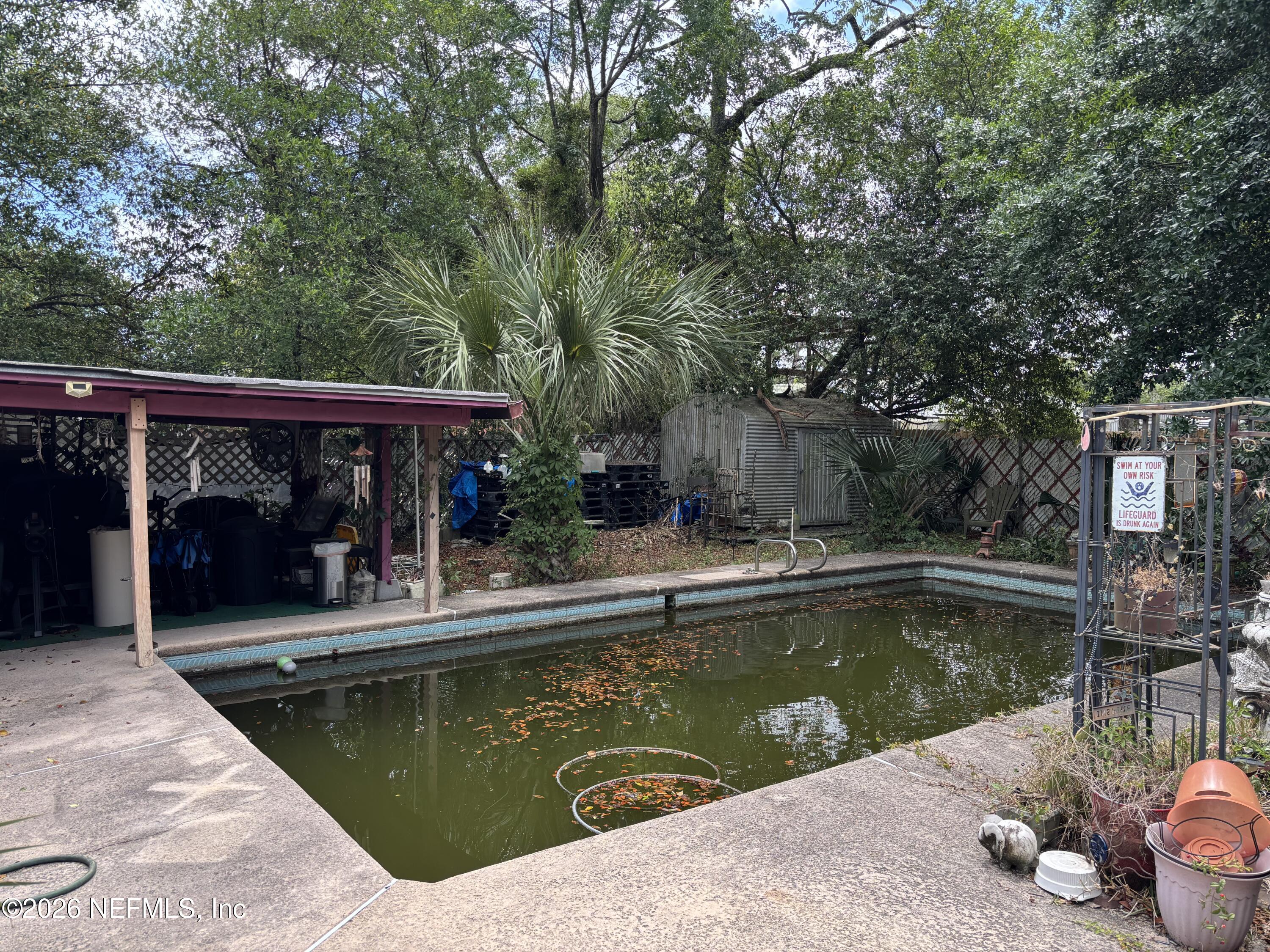 918 Bacall Road Jacksonville, FL 32218 - Photo 11 of 12 a view of a swimming pool with a patio