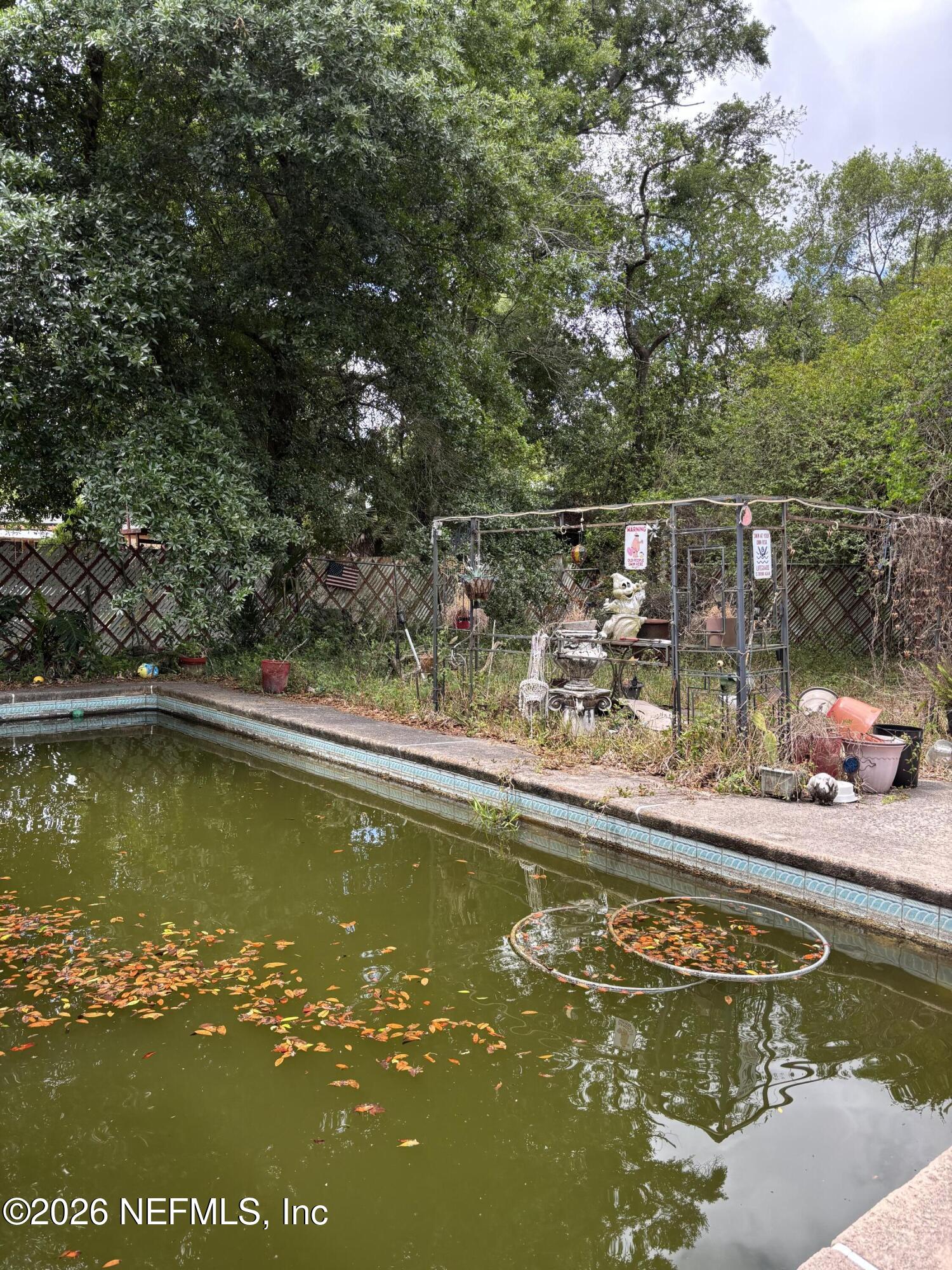 918 Bacall Road Jacksonville, FL 32218 - Photo 12 of 12 a view of a swimming pool with an outdoor seating