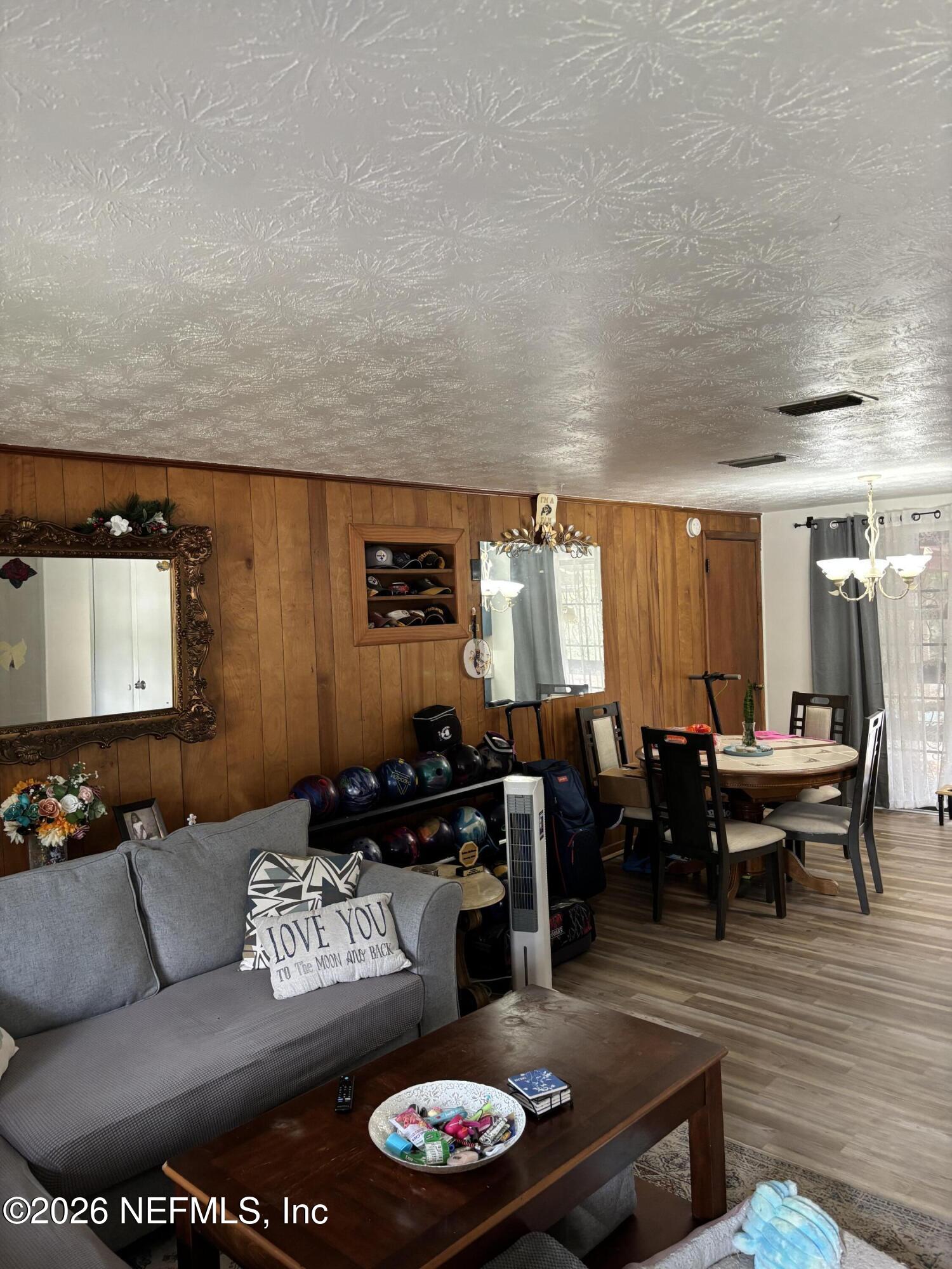 918 Bacall Road Jacksonville, FL 32218 - Photo 2 of 12 a living room with furniture and a wooden floor