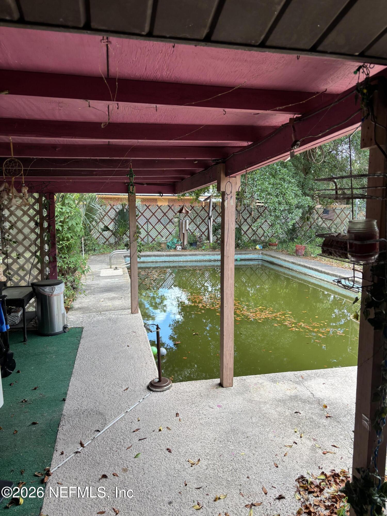 918 Bacall Road Jacksonville, FL 32218 - Photo 10 of 12 a view of a backyard with a swimming pool