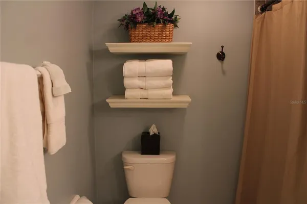 a bathroom with a toilet and a sink