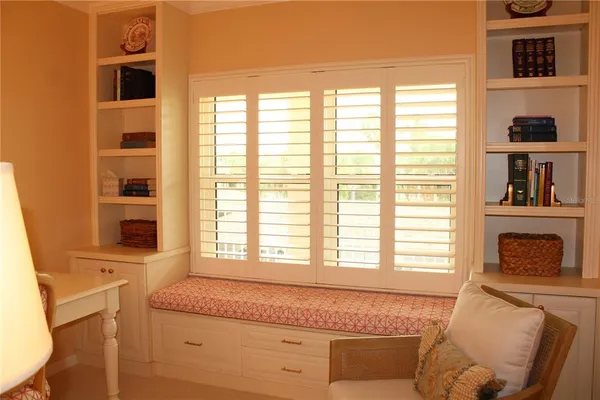 a living room with fireplace furniture and a window