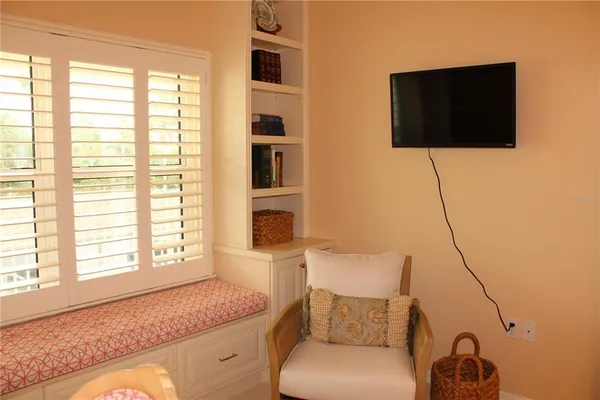 a living room with a couch and a flat screen tv
