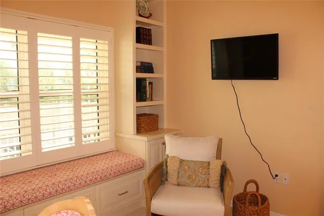 a living room with a couch and a flat screen tv