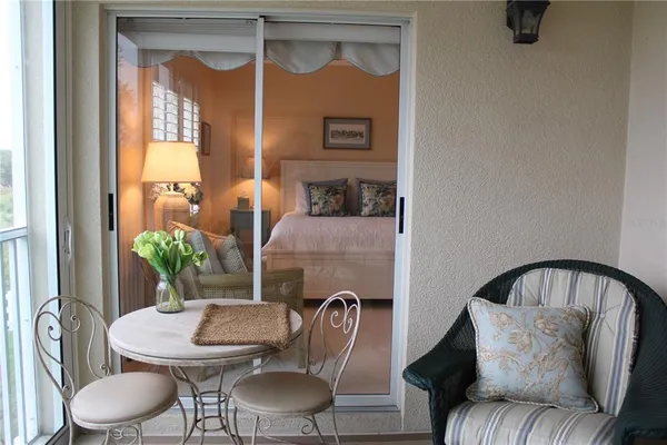 a balcony with furniture and window