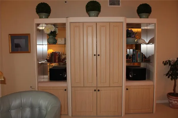 a view of a livingroom with furniture and closet