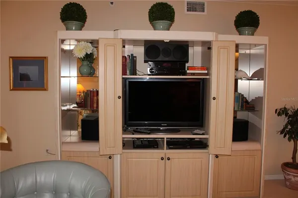 a view of kitchen with a sink and refrigerator