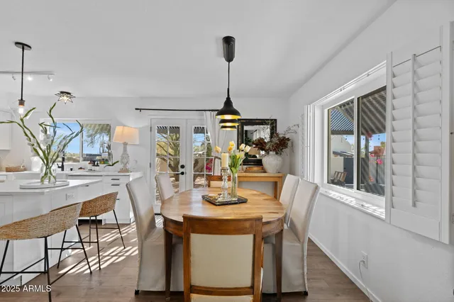 a bedroom with furniture and a mirror