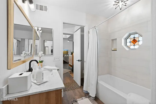 a bathroom with a sink and a mirror