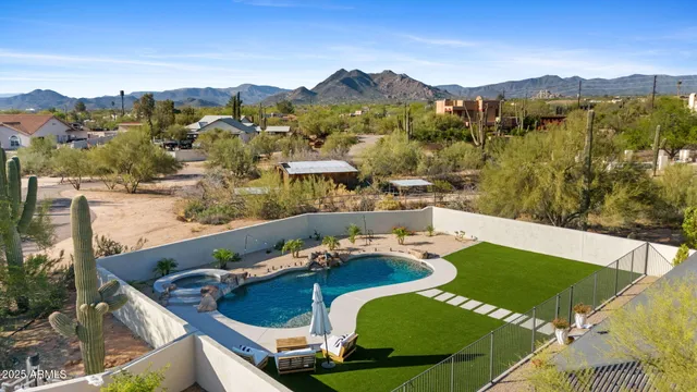 a view of a balcony with two chairs