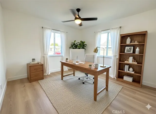a living room with furniture a window and a table