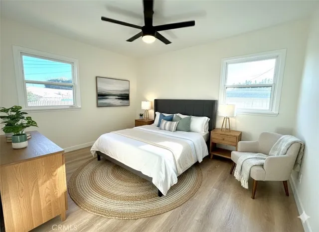 a bedroom with a bed and window