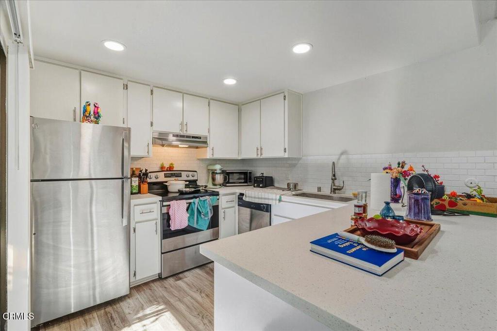3380 Bullock Lane San Luis Obispo, CA 93401 - Photo 2 of 14 a kitchen with refrigerator and white cabinets
