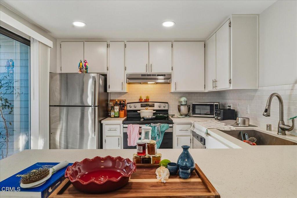 3380 Bullock Lane San Luis Obispo, CA 93401 - Photo 4 of 14 a kitchen with granite countertop a refrigerator stove and sink