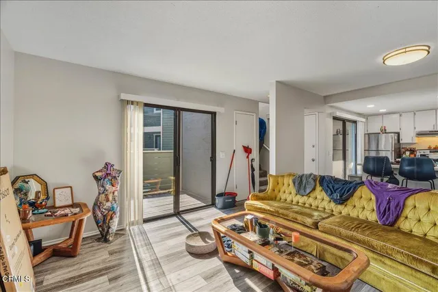 a living room with furniture and a table