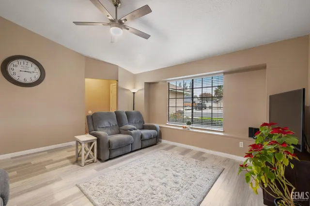 a view of a dining room with furniture and a window