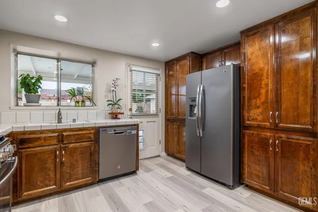 a potted plant sitting on top of a kitchen counter