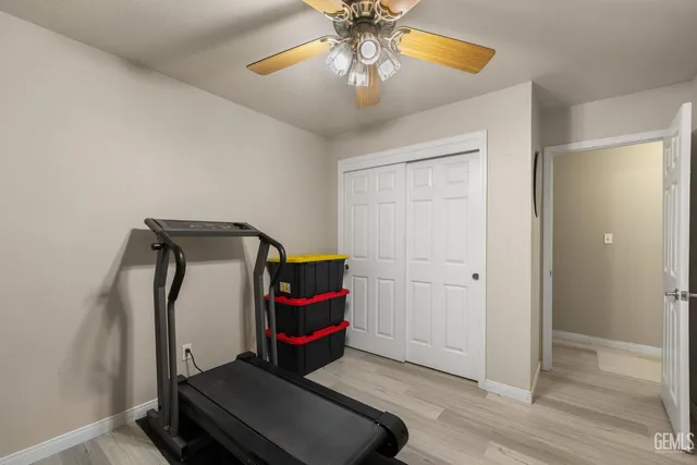 a bathroom with a sink a toilet a mirror a bathtub and shower