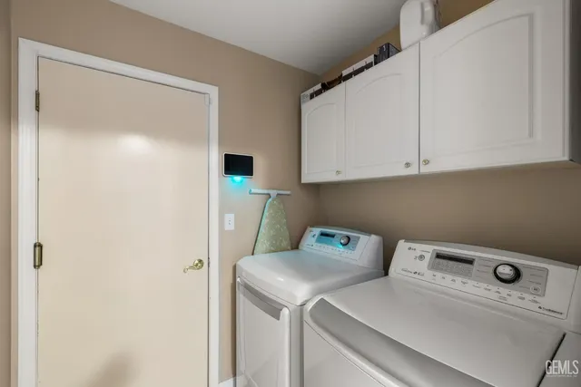 a view of walk in closet with wooden floor
