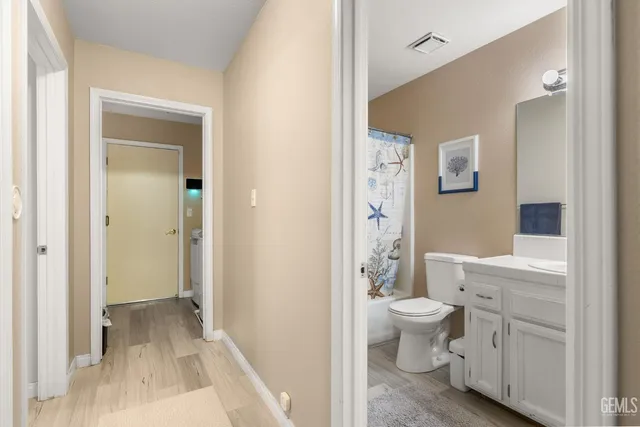 a work room with furniture and a ceiling fan