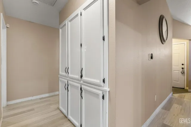 a view of swimming pool with seating area and barbeque oven