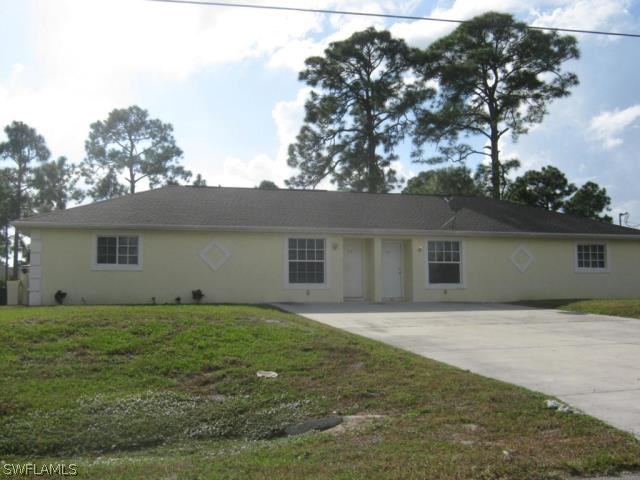 a house that has a tree in front of it