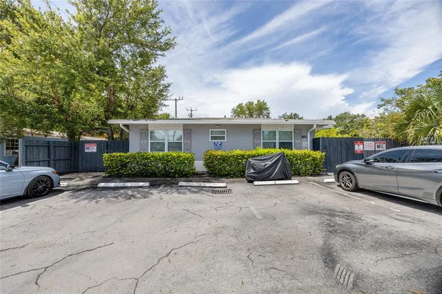 a view of a car parked in front of house