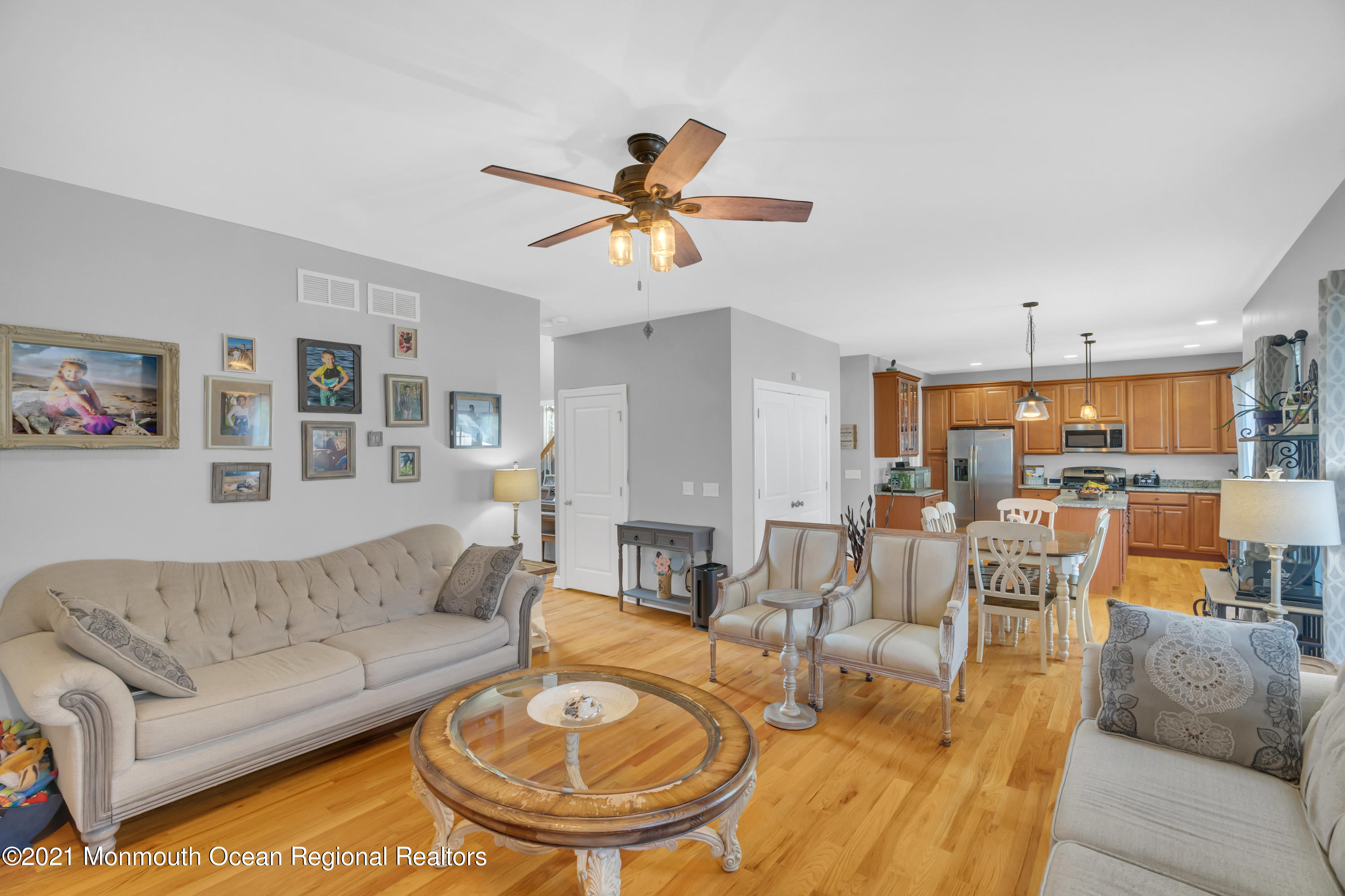3809 River Road Point Pleasant, NJ 08742 - Photo 14 of 66 a living room with furniture kitchen view and a chandelier