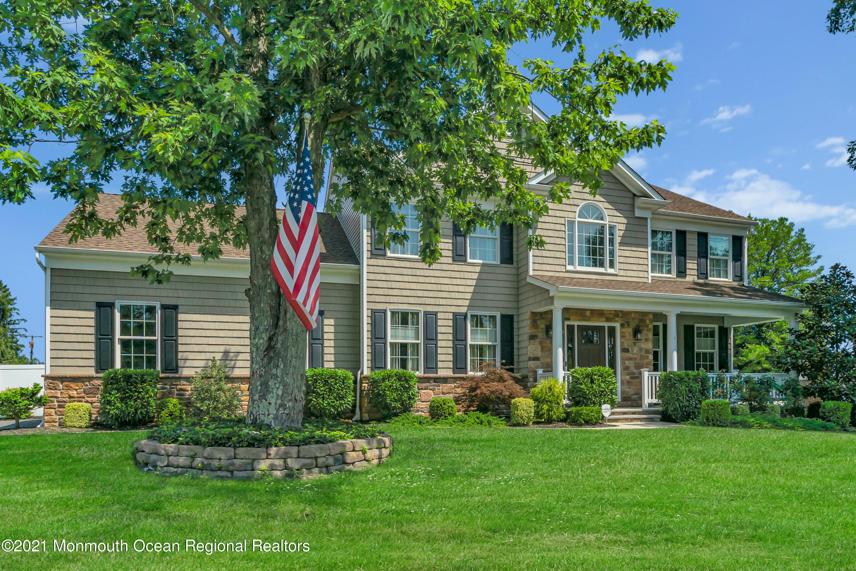 3809 River Road Point Pleasant, NJ 08742 - Photo 3 of 66 a front view of a house with a garden