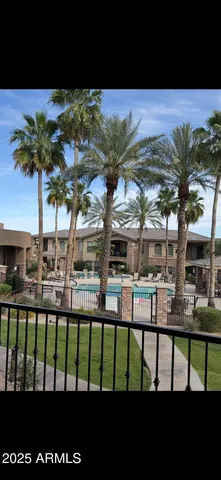 a view of a chairs and table in the balcony
