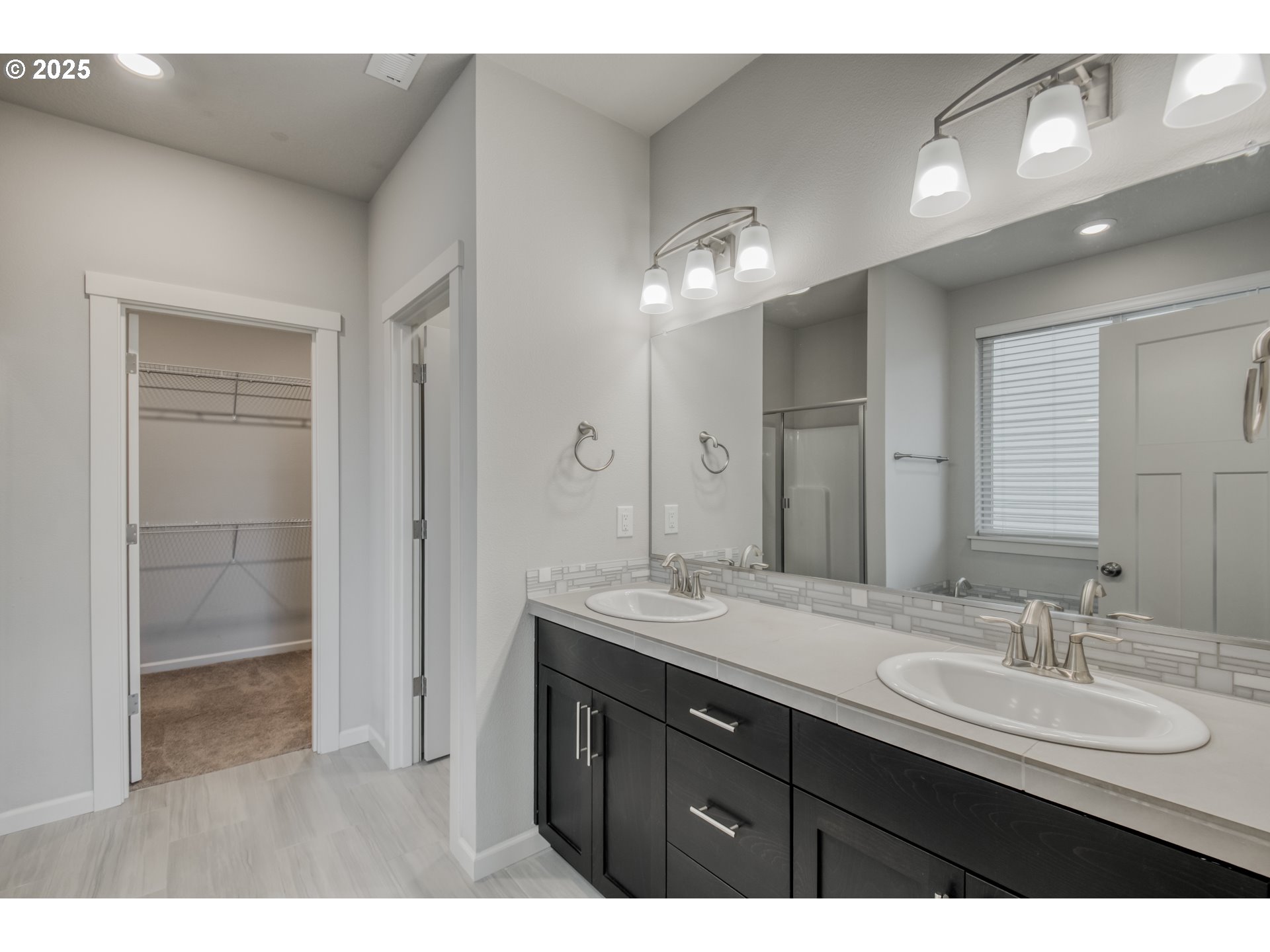 6443 Southeast 22nd Street Gresham, OR 97080 - Photo 13 of 27 a bathroom with a sink double vanity and a mirror