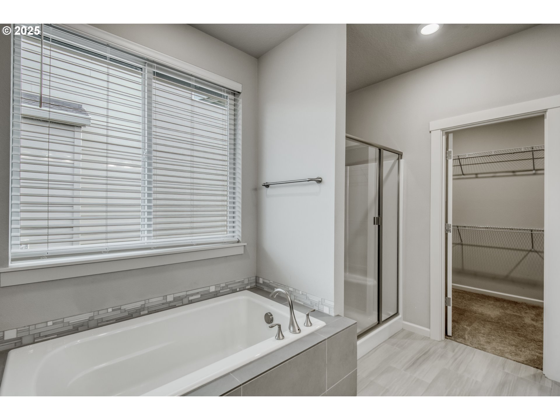 6443 Southeast 22nd Street Gresham, OR 97080 - Photo 14 of 27 a bathroom with a tub a sink and a window