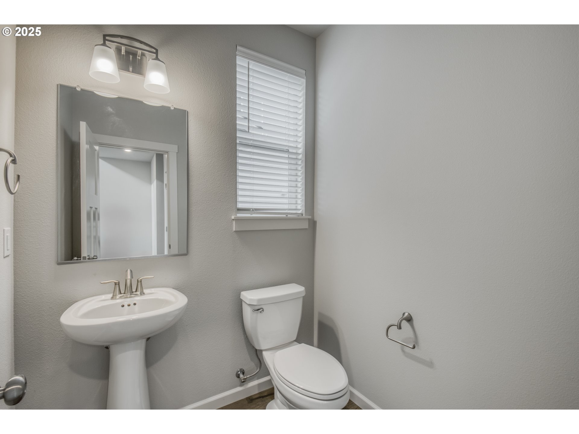 6443 Southeast 22nd Street Gresham, OR 97080 - Photo 17 of 27 a bathroom with a toilet sink and mirror