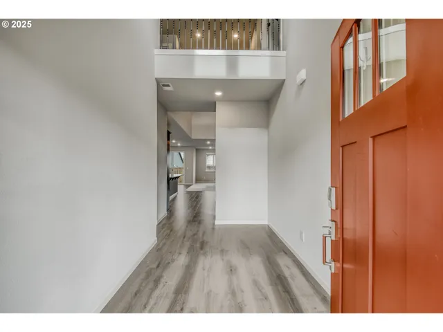 a view of entryway with wooden floor