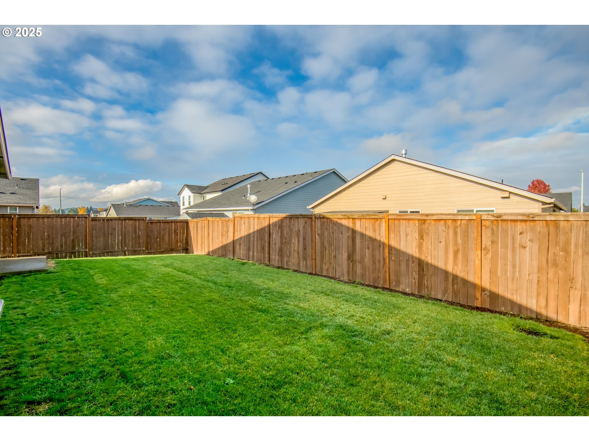 6443 Southeast 22nd Street Gresham, OR 97080 - Photo 24 of 27 a view of a backyard with a fence and wooden fence