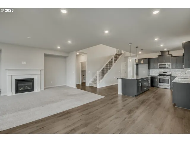 a view of kitchen with furniture and fireplace