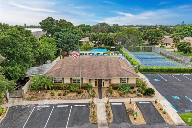an aerial view of a house with garden space and street view