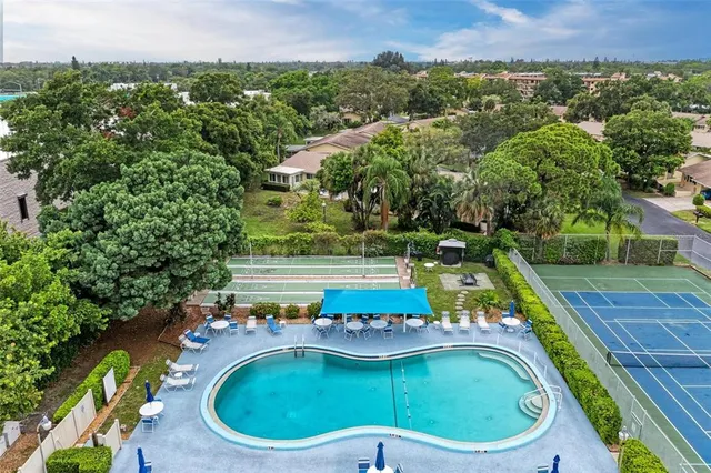 a view of a swimming pool with a yard