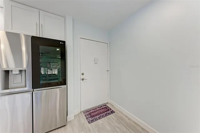 a view of an entryway with wooden floor